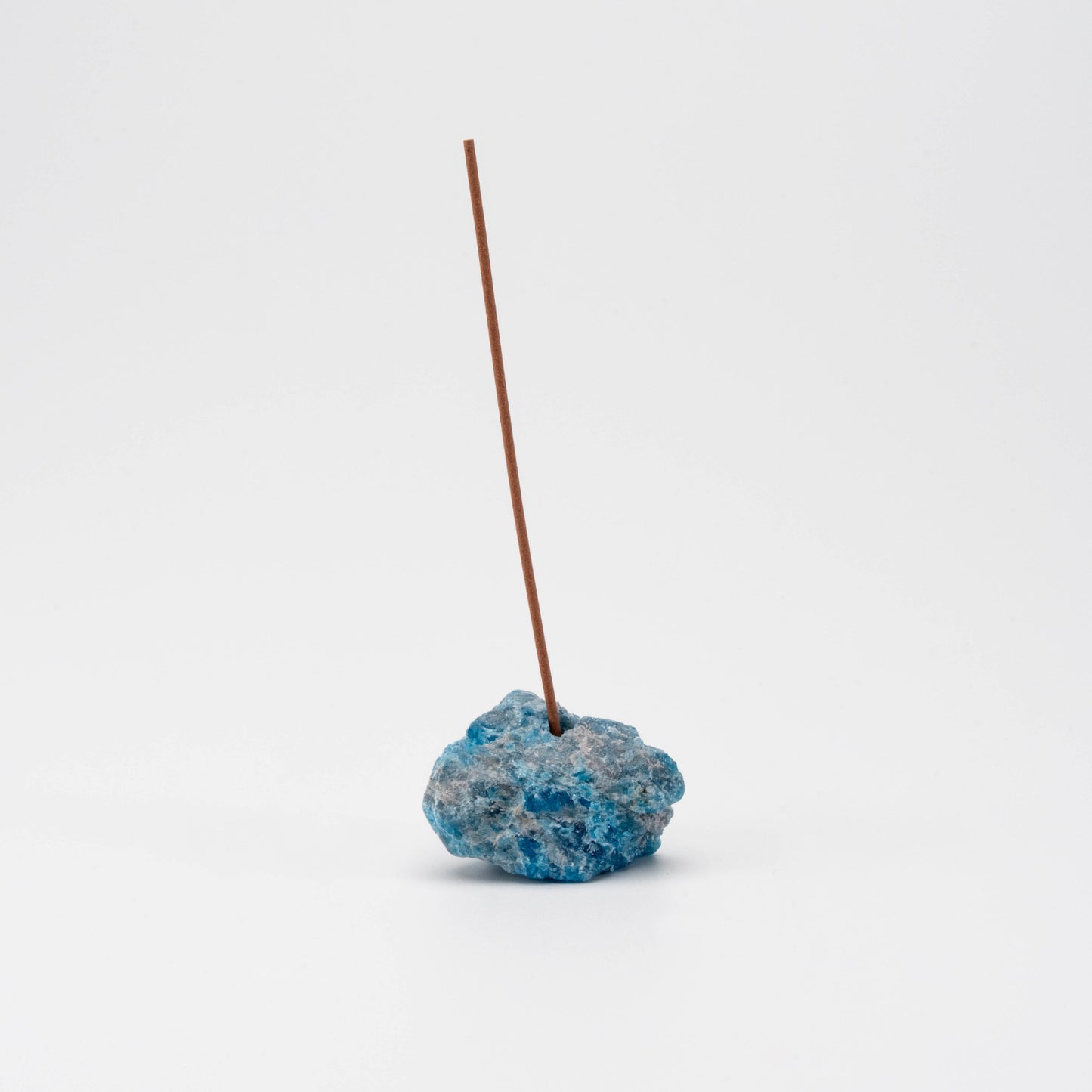 ocean-blue Apatite incense holder with a single upright incense stick
