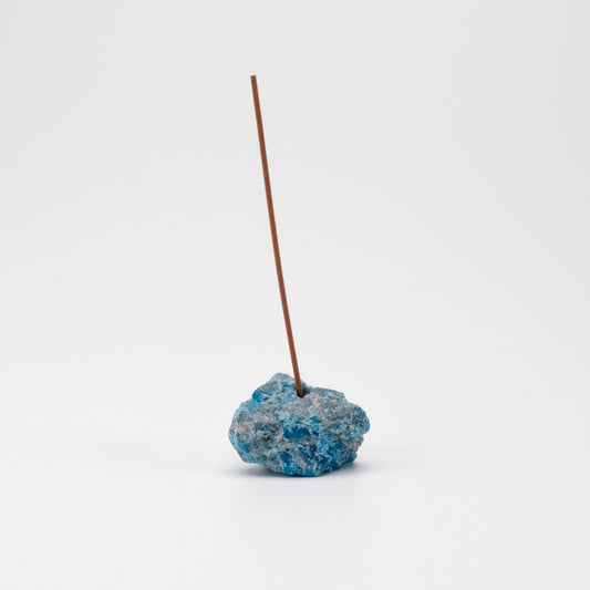 ocean-blue Apatite incense holder with a single upright incense stick