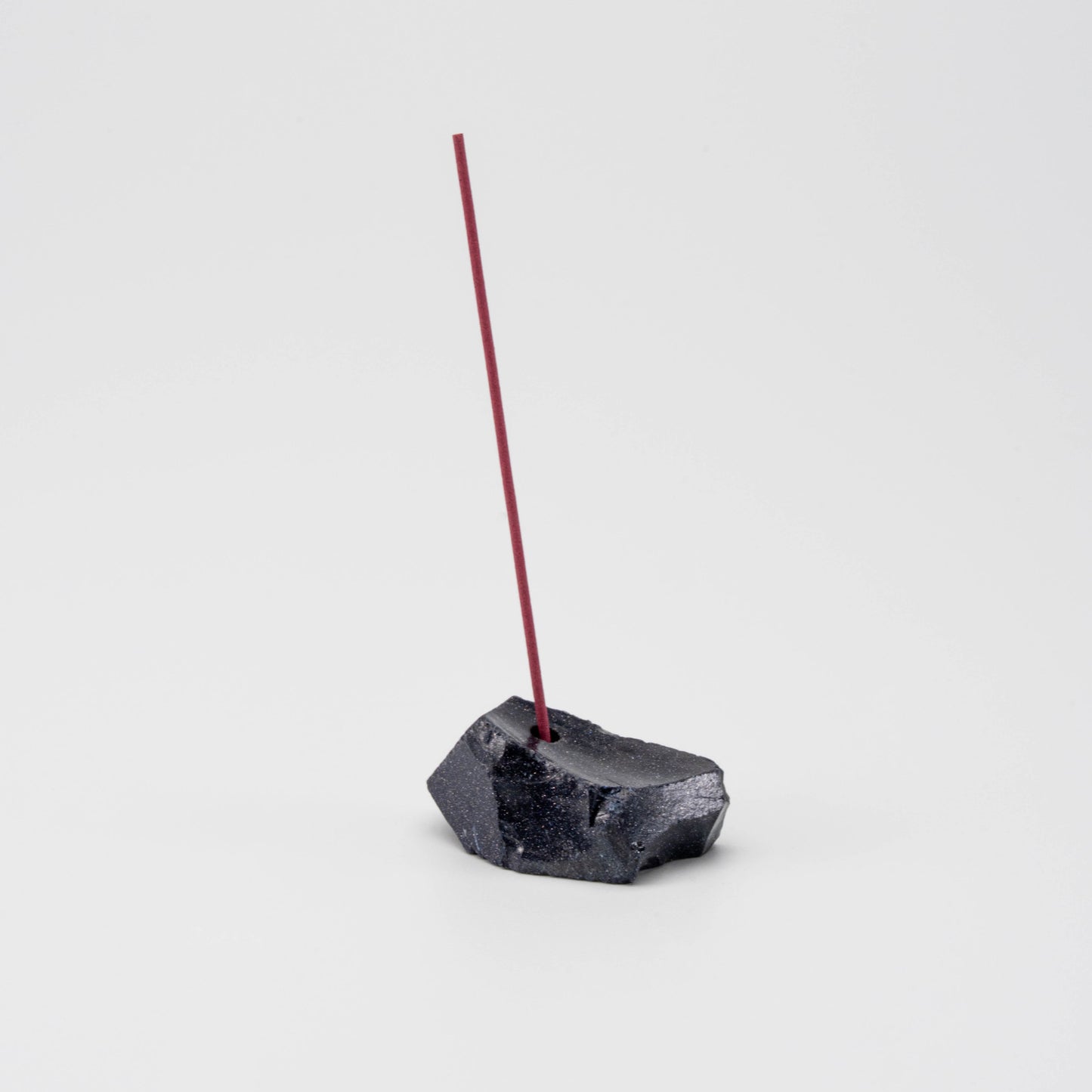 Sparkling navy Blue Goldstone incense holder with a single upright incense stick