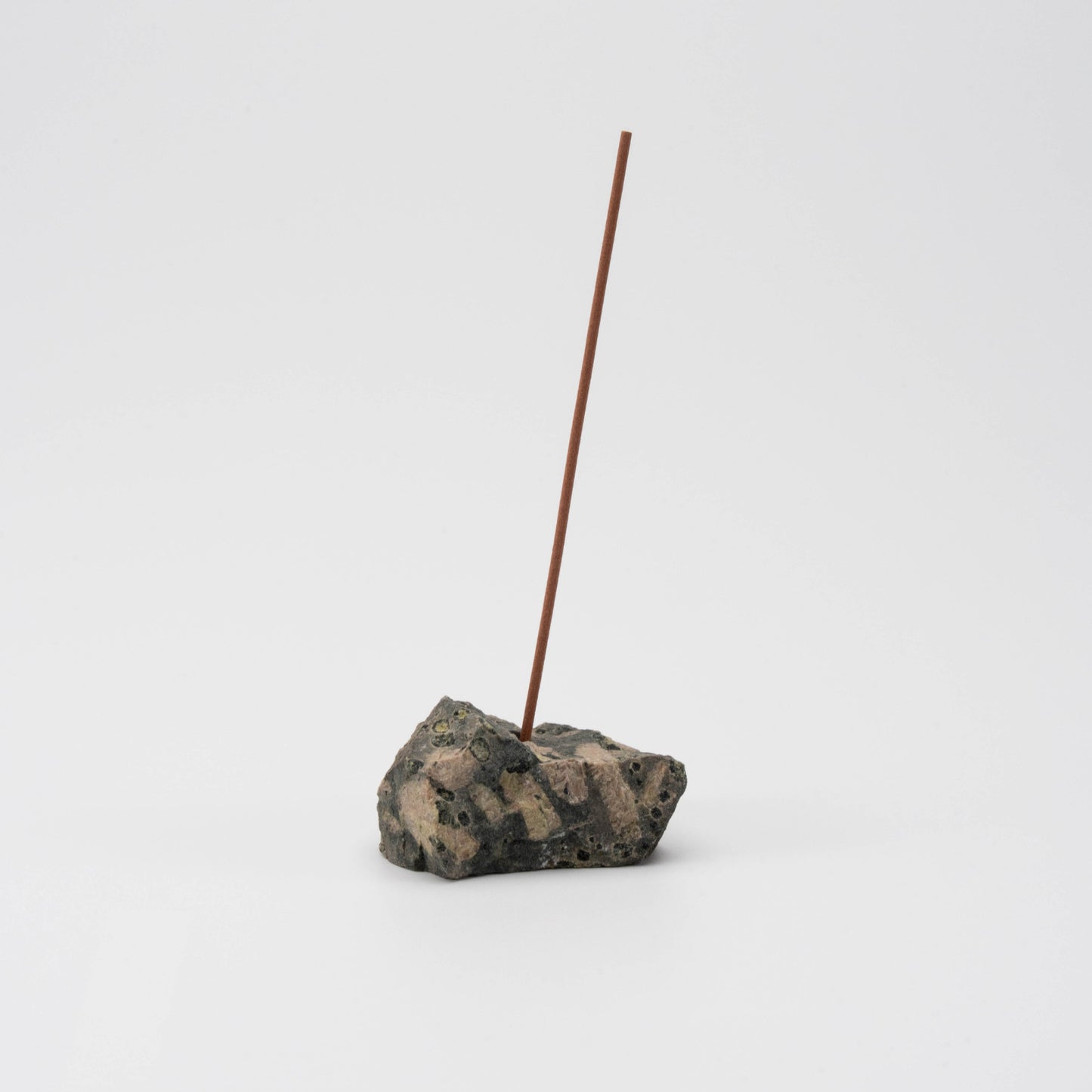 Dark green Kambaba Jasper incense holder with a single upright incense stick