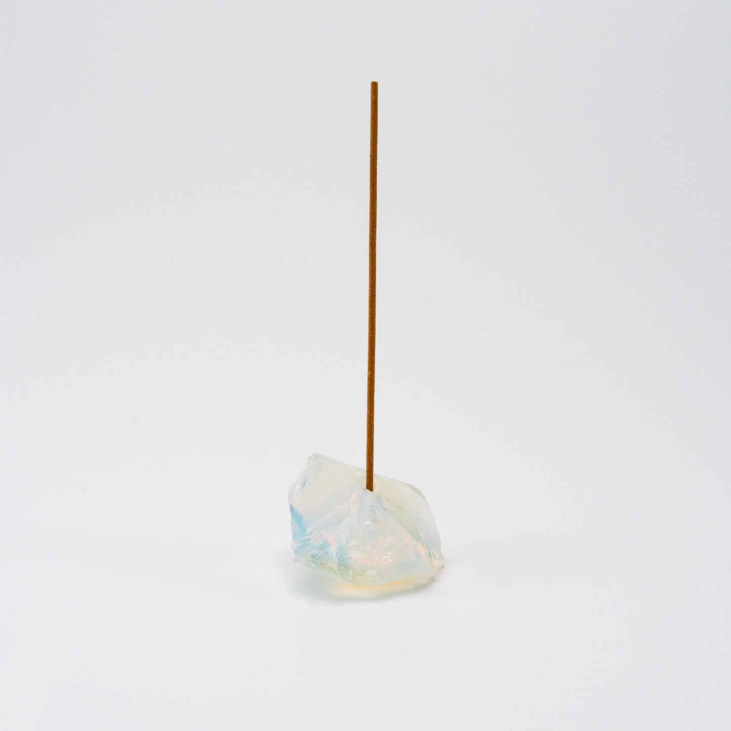 Iridescent Opal incense holder with a single upright incense stick