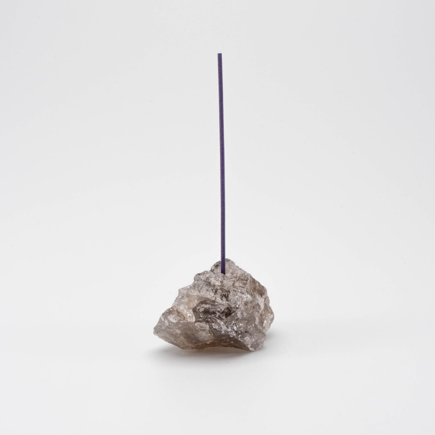 Brown Smoky Quartz incense holder with a single upright incense stick
