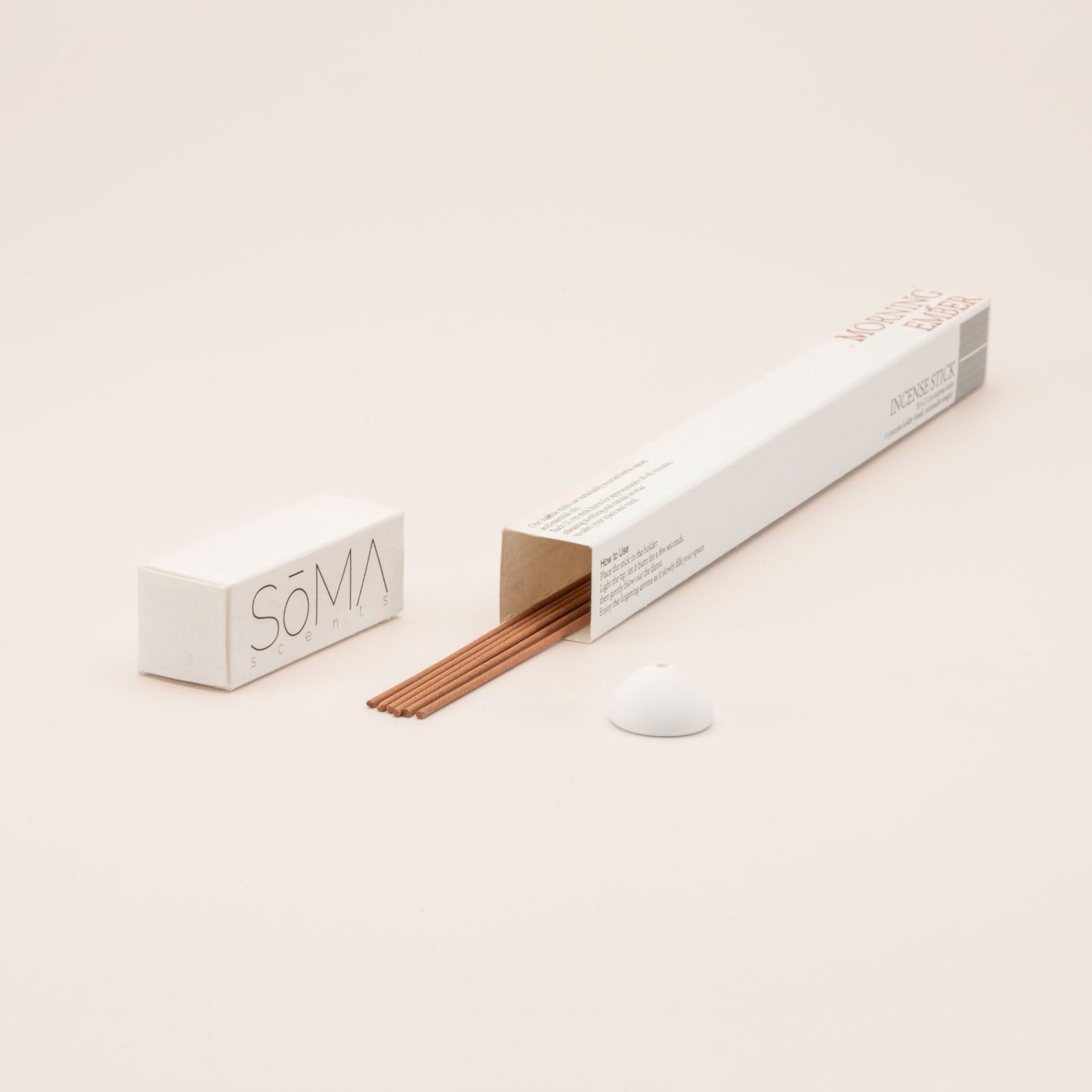 SomaScents Morning Ember incense sticks in minimalist packaging, displayed with coffee-coloured incense sticks and a small white ceramic holder