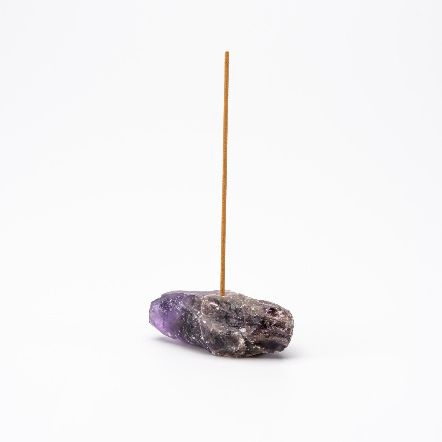 purple Amethyst gemstone incense holder with a single upright incense stick