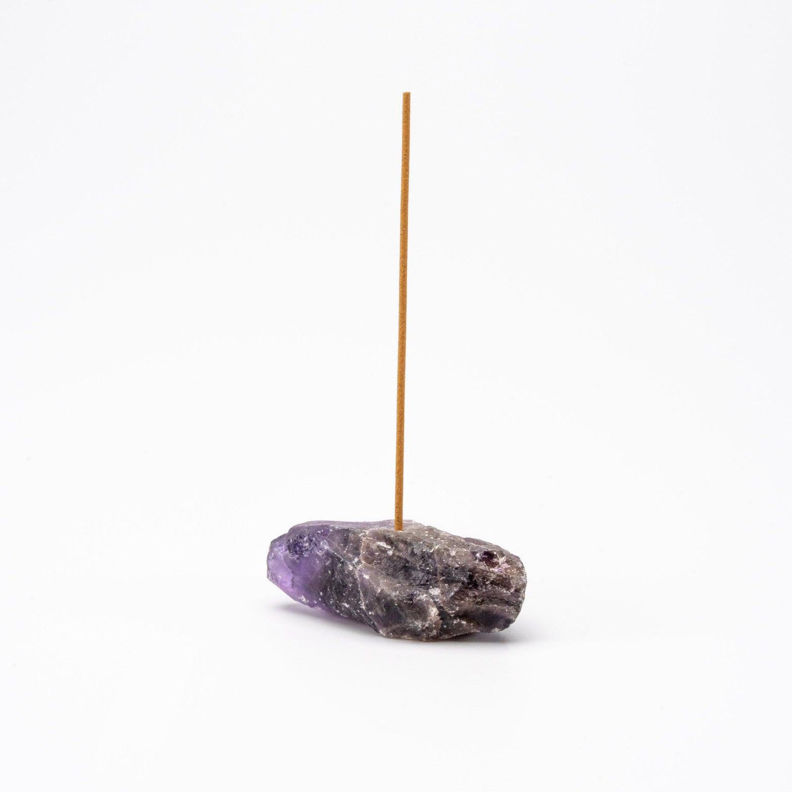 purple Amethyst gemstone incense holder with a single upright incense stick