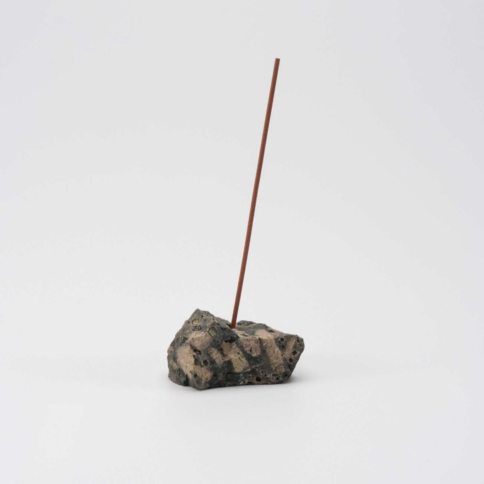 Dark green Kambaba Jasper incense holder with a single upright incense stick