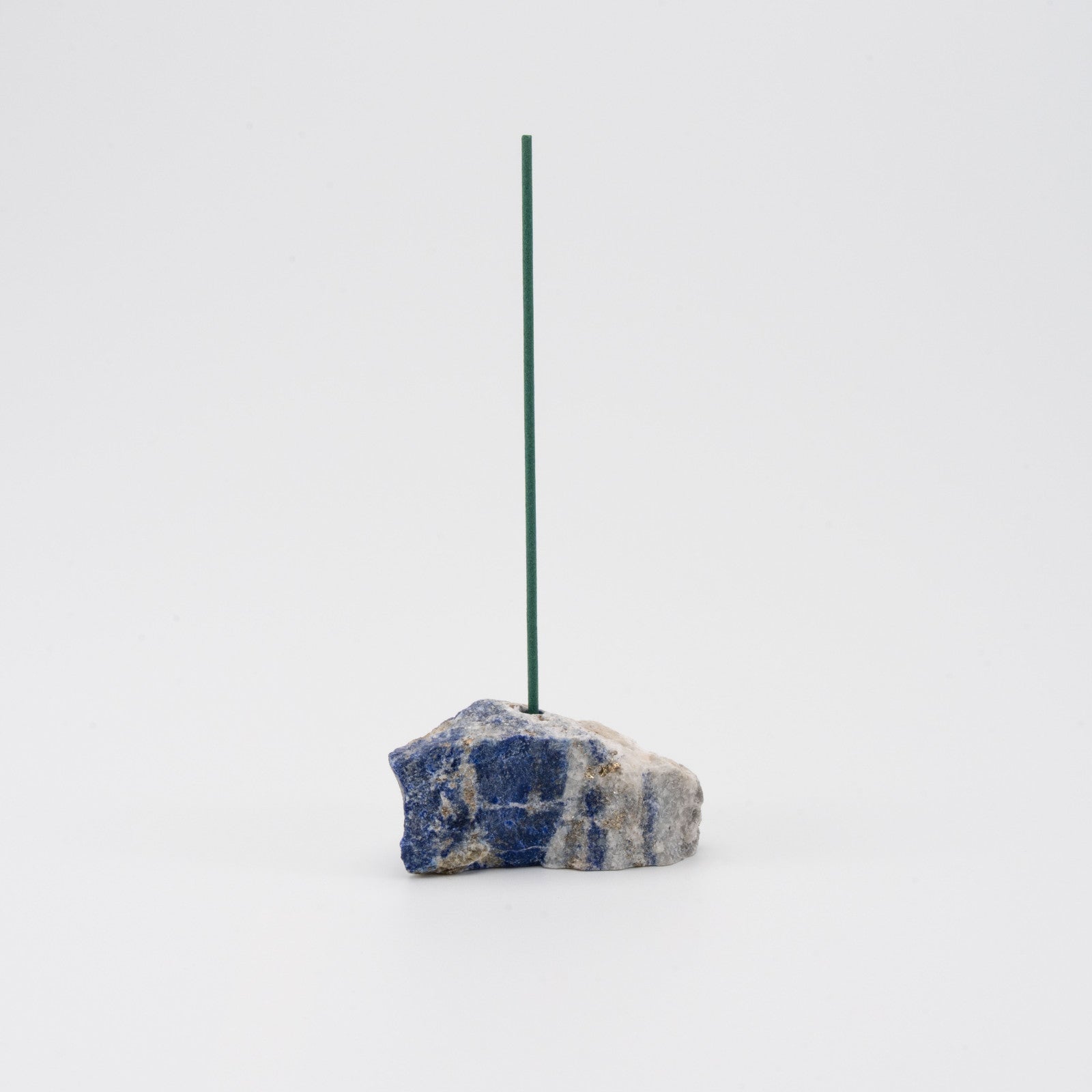 Deep blue Lapis Lazuli incense holder with a single upright incense stick