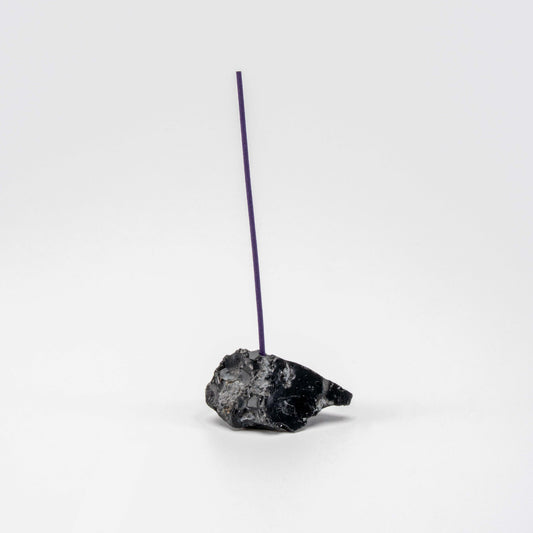 Jet-black Obsidian incense holder with a single upright incense stick