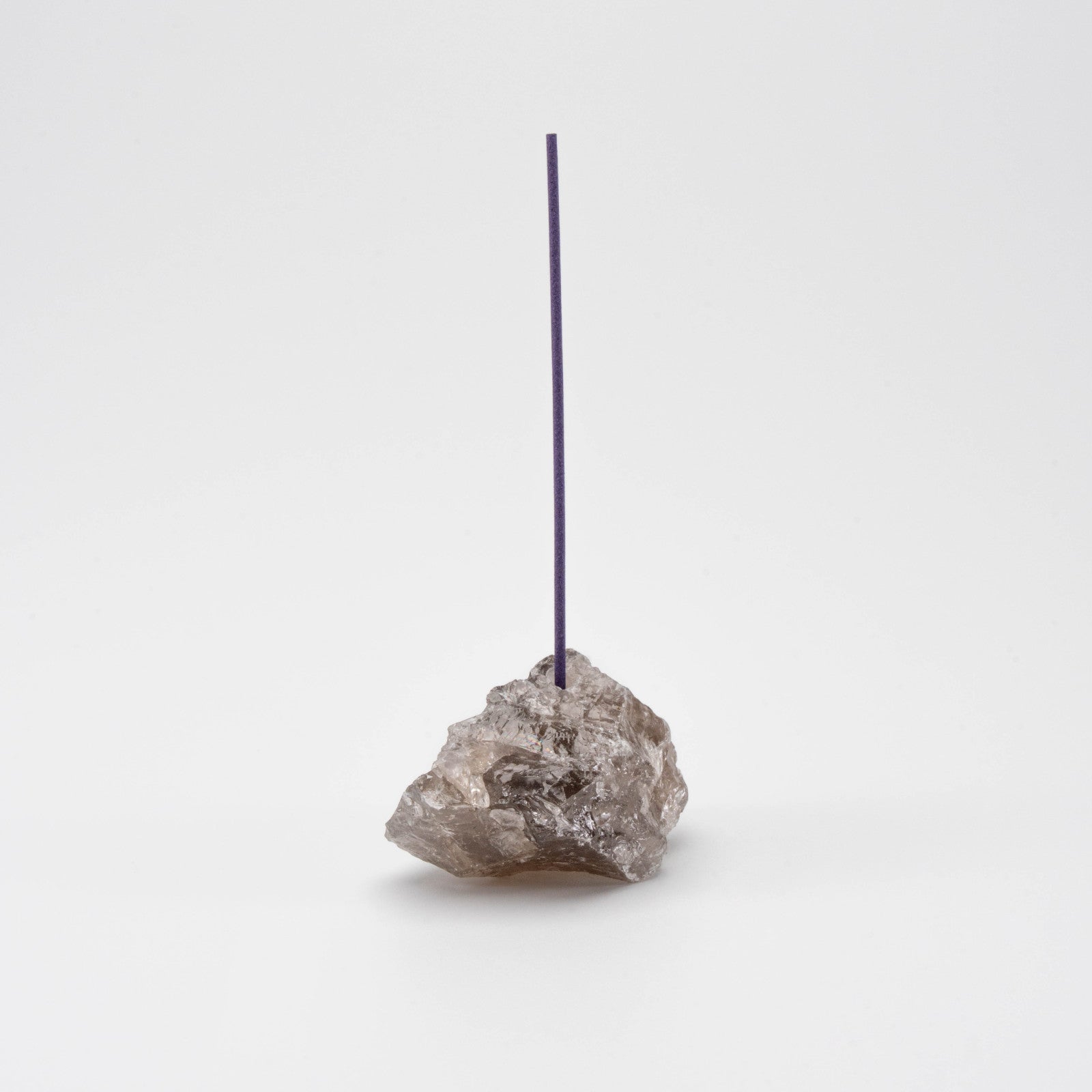 Brown Smoky Quartz incense holder with a single upright incense stick
