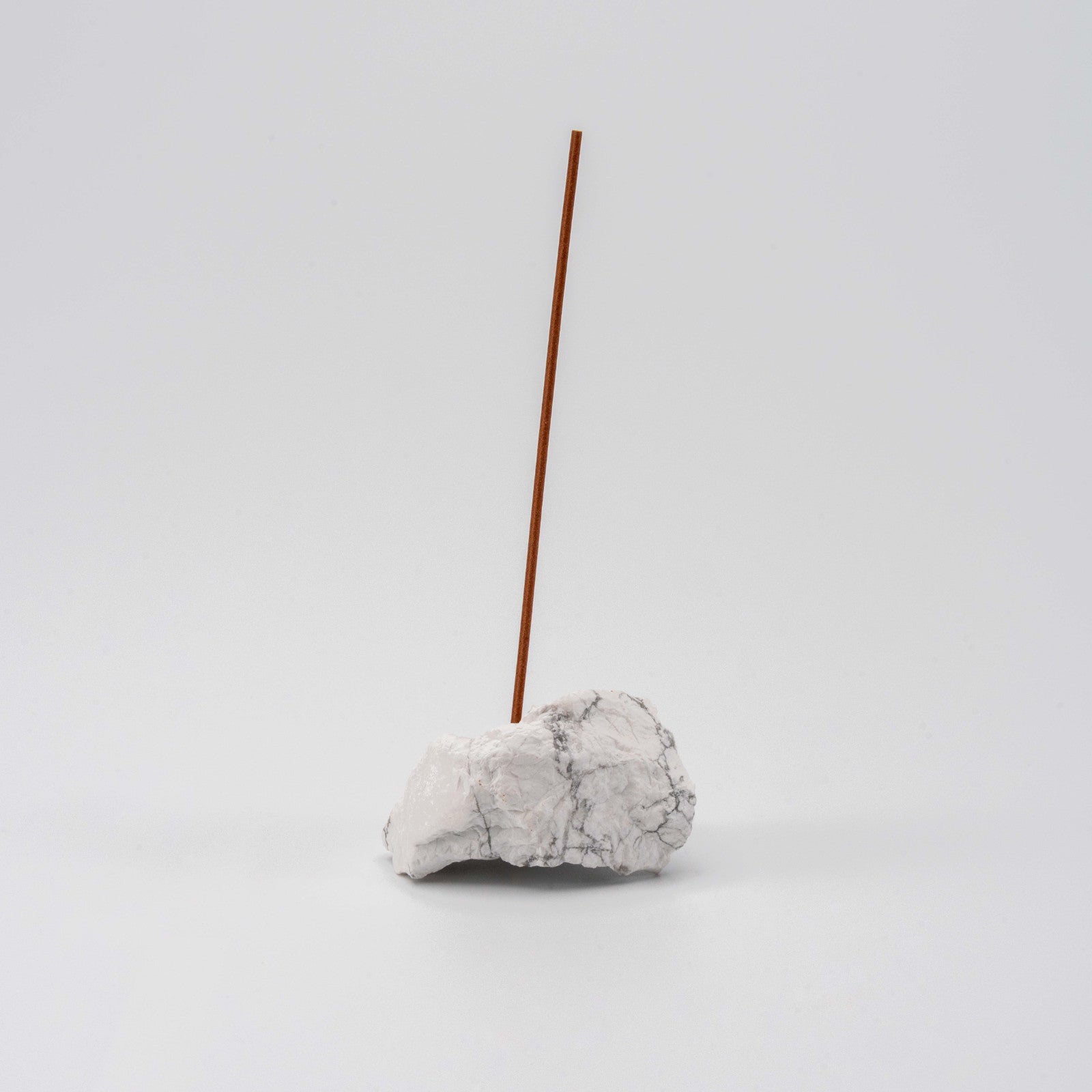 Soft white Howlite incense holder with a single upright incense stick