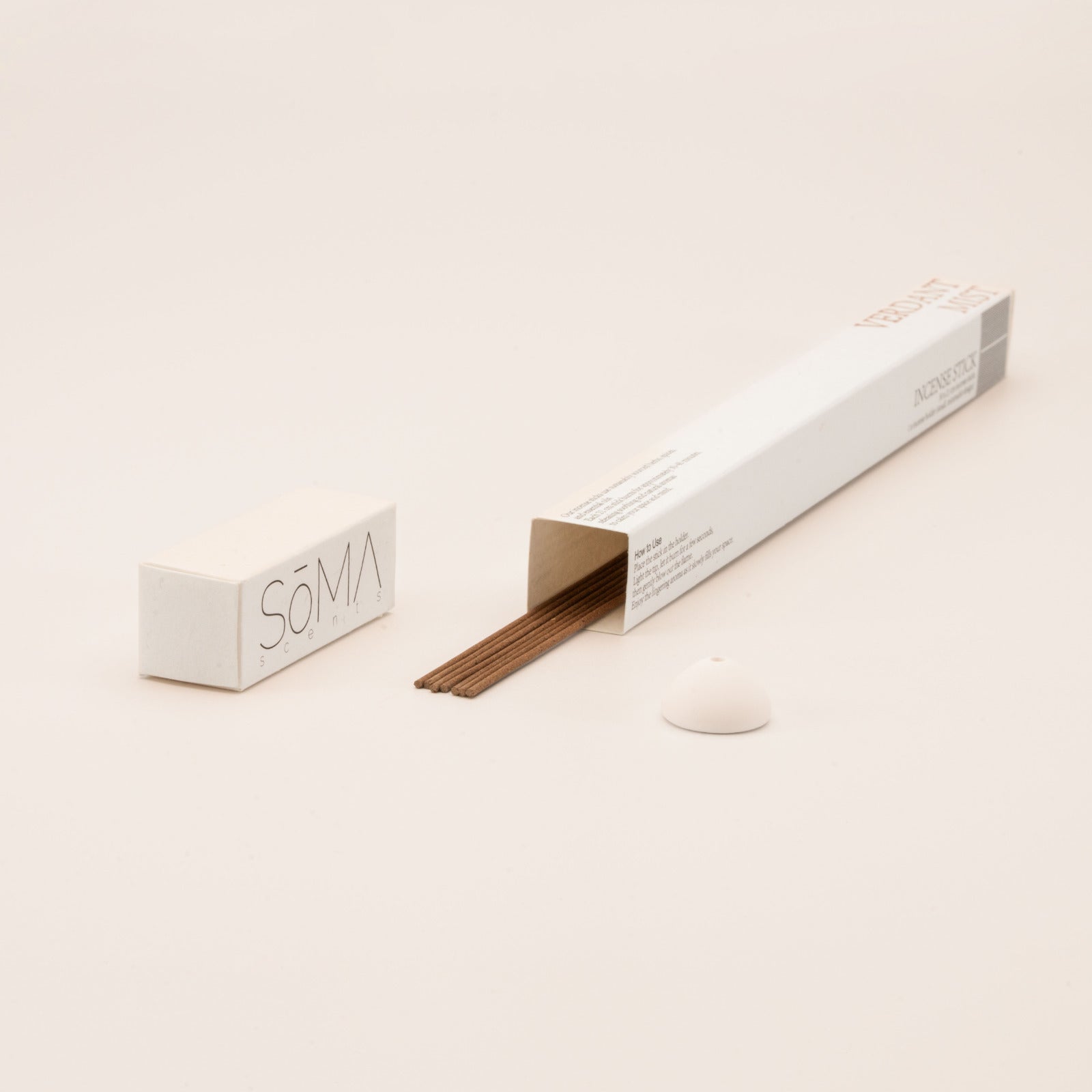 SomaScents Verdant Mist incense sticks in minimalist packaging, displayed with brown incense sticks and a small white ceramic holder