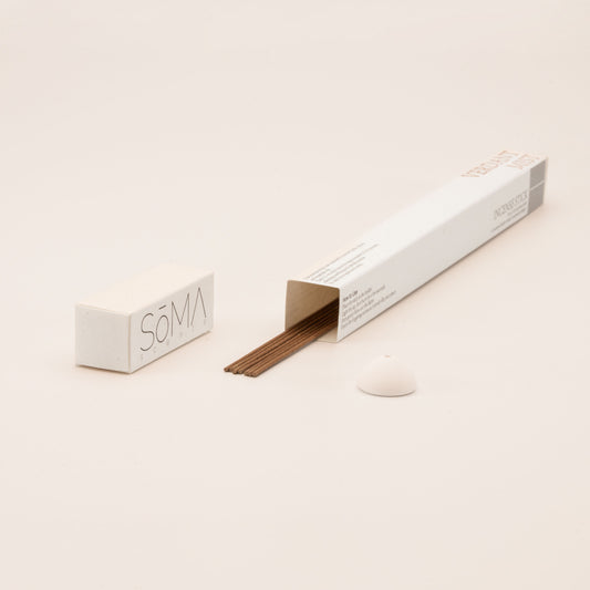 SomaScents Verdant Mist incense sticks in minimalist packaging, displayed with brown incense sticks and a small white ceramic holder