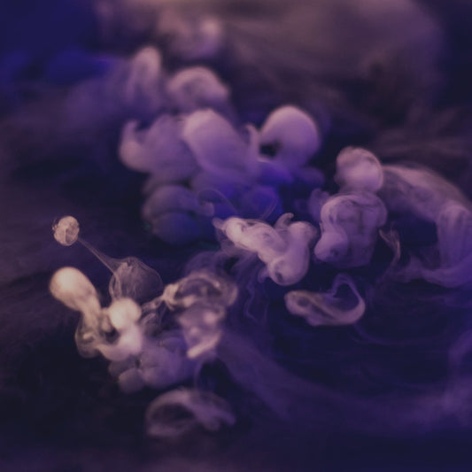 Swirls of violet and white smoke in a dreamy haze